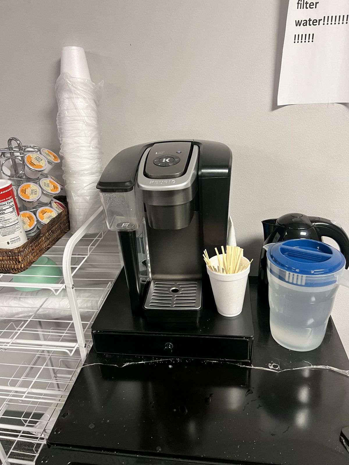 Office coffee brewer with pods and supplies