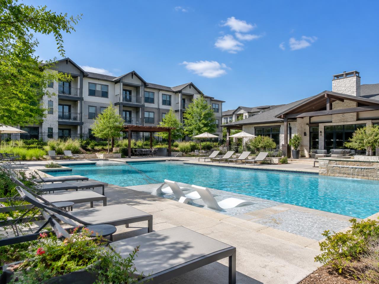 Apartment complex pool and clubhouse in a Dallas-area suburb